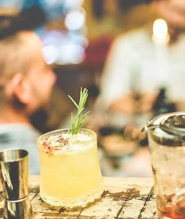 Craft Cocktails With People Chatting On The Background Craft Cocktails With People Chatting On The Background