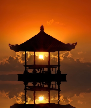 A small beach pavilion in Sanur, Bali during sunset