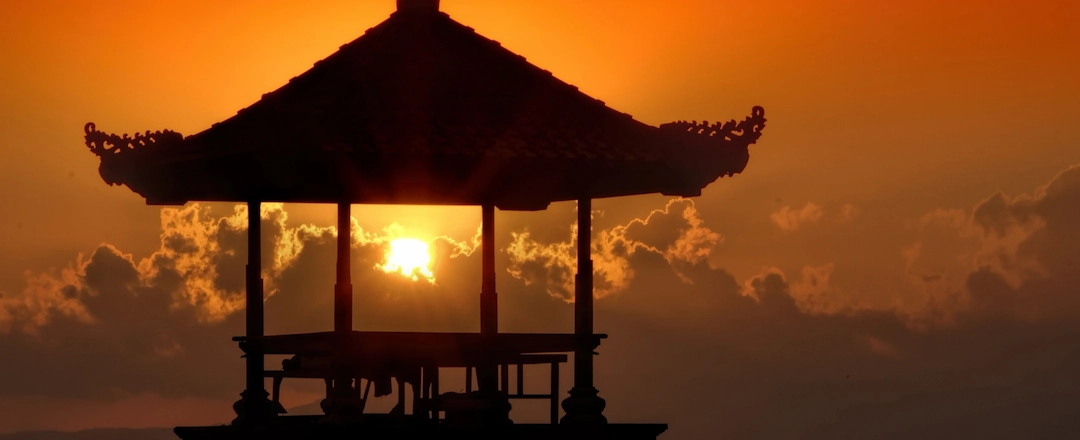 A small beach pavilion in Sanur, Bali during sunset