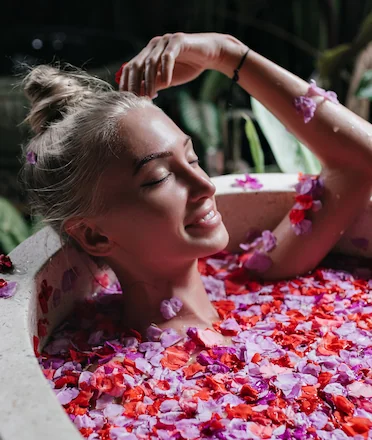 Woman Enjoying Flower Bath After Spa