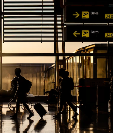 People Walking in Airport Terminal