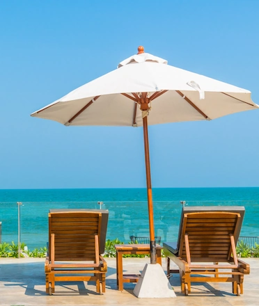 Cozy Restaurant Seating With Umbrella and Ocean View Cozy Restaurant Seating With Umbrella and Ocean View