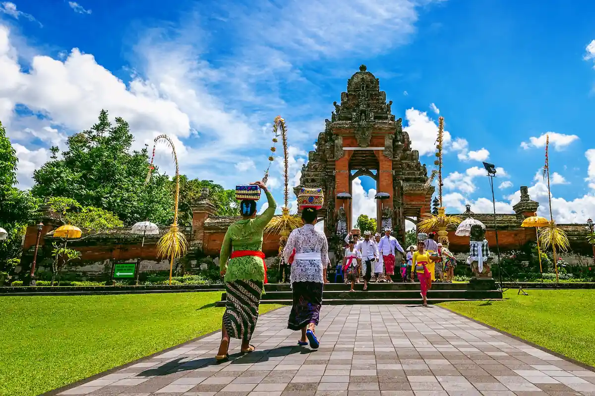 Balinese Gathering for Ceremony Under Clear Sky