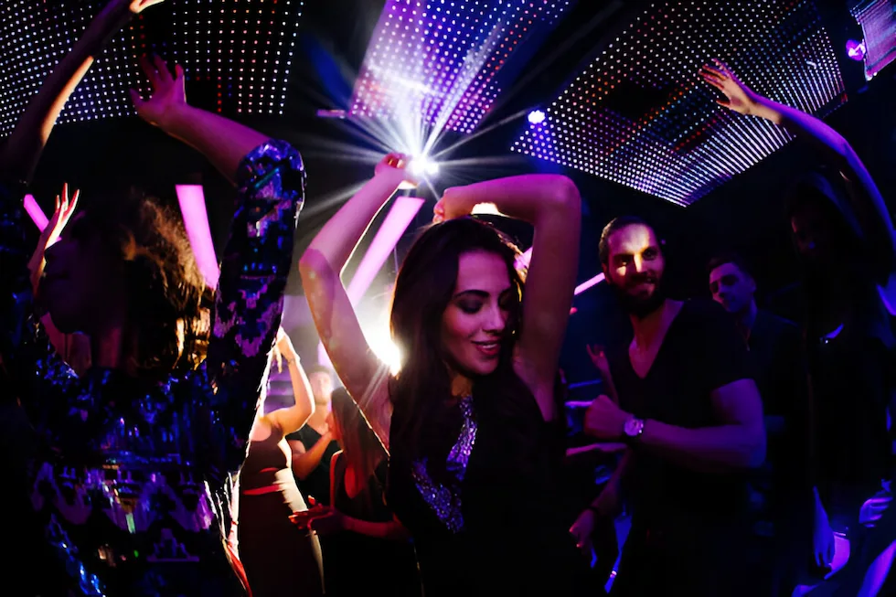 a beautiful girl dancing in the nightclub