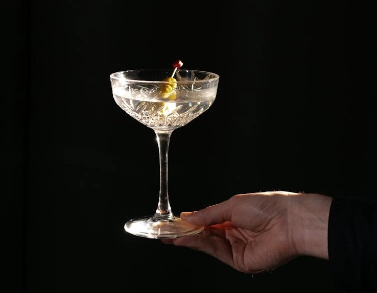 a hand with martini