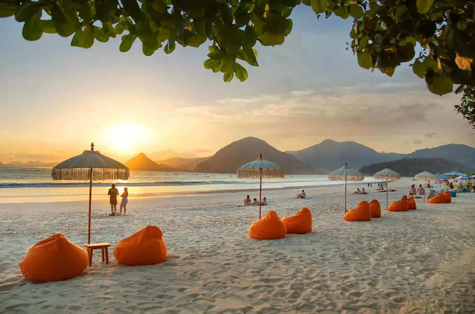 beach front with beanbags and umbrellas