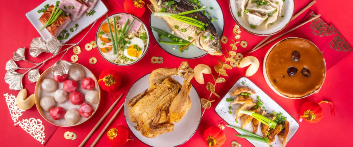 Festive Chinese New Year dining table filled with traditional dishes
