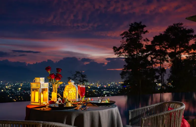 Valentine dinner table set with sunset backdrop