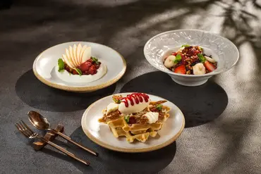 3 plates of beautiful food setting 