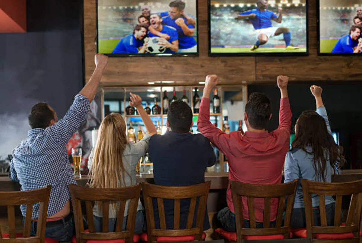excited group of people watching soccer