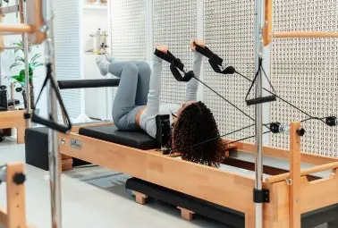 a woman doing pilates