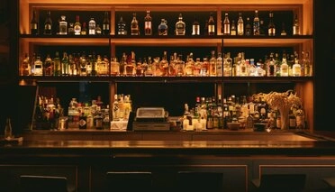 Warmly lit bar with shelves