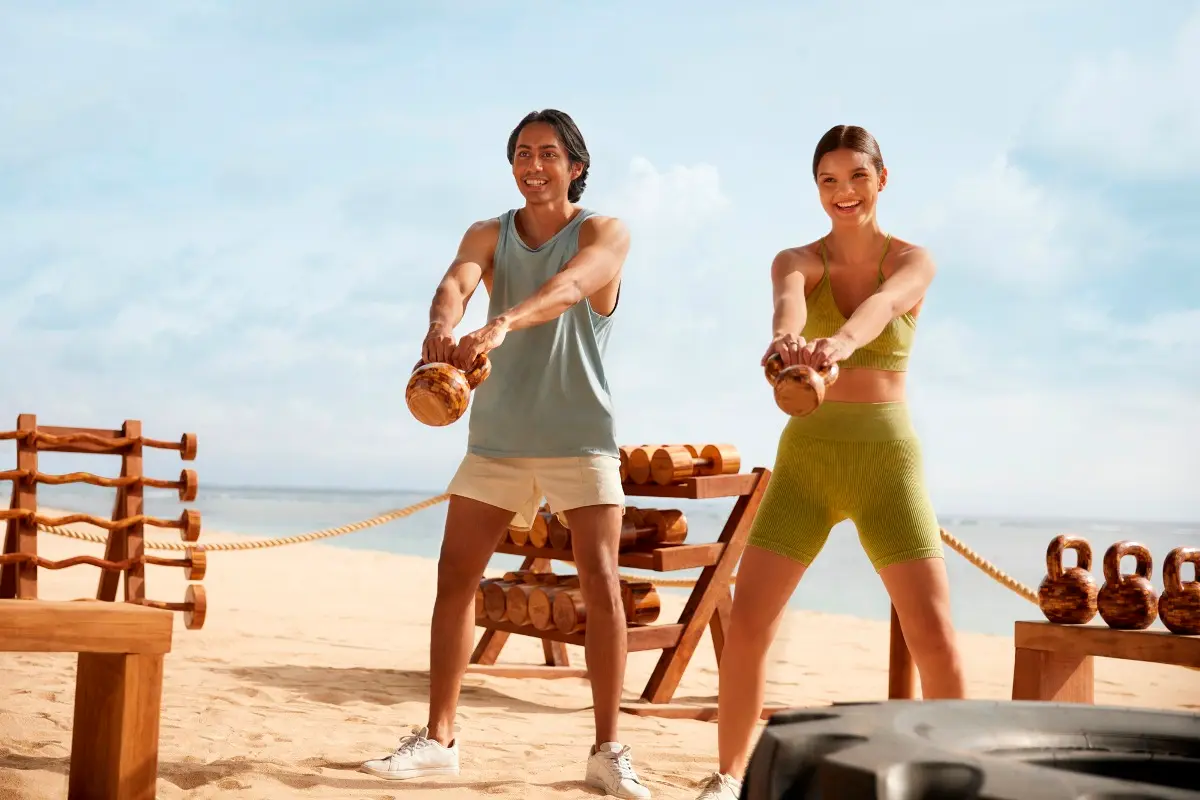 boy and girl beach workout