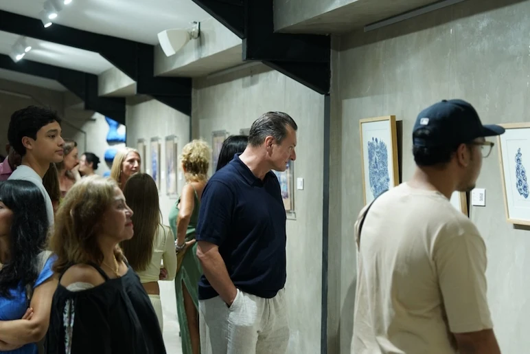 People looking at the artwork