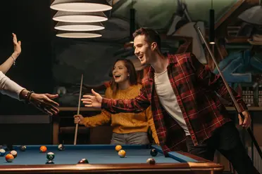 People_playing_billiard_together
