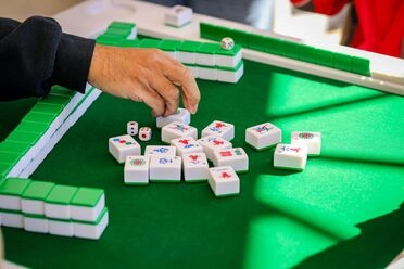 a hand playing mahjong