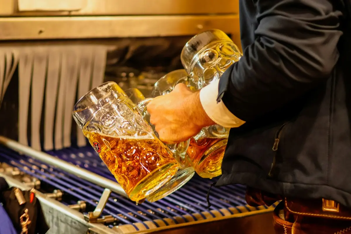 man with glasses of beer