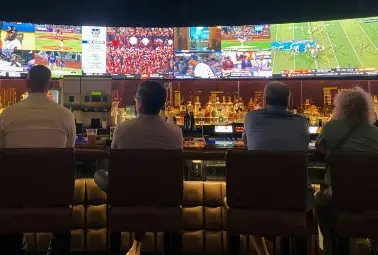 people watching sports at the bar
