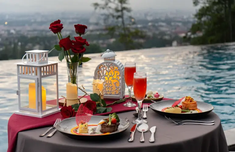 Valentine dinner table set with sunset backdrop